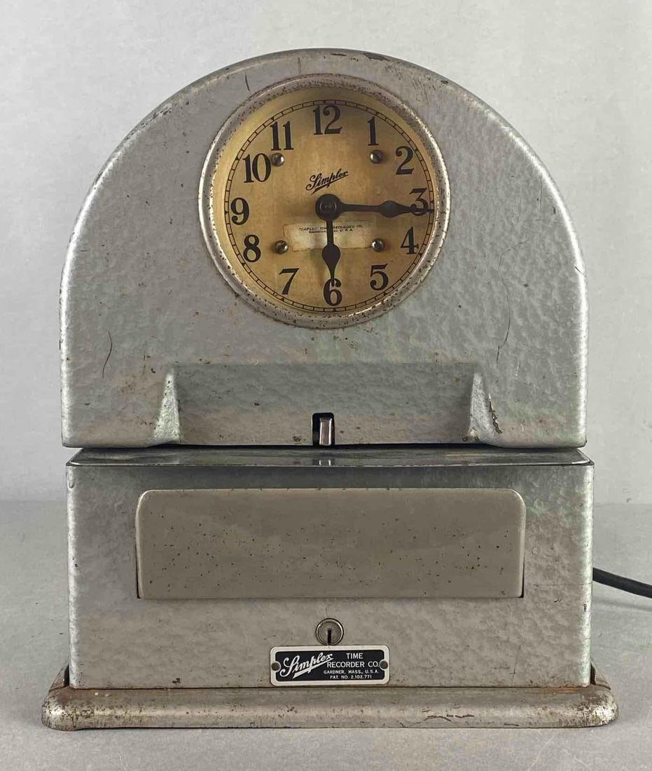 Simplex Electric Time Recorder: Powers on, Unknown working condition, With group or 2002 Pyramid time stamp sheets, Measures 12 1/2 x 11 x 7 1/2 inches.
