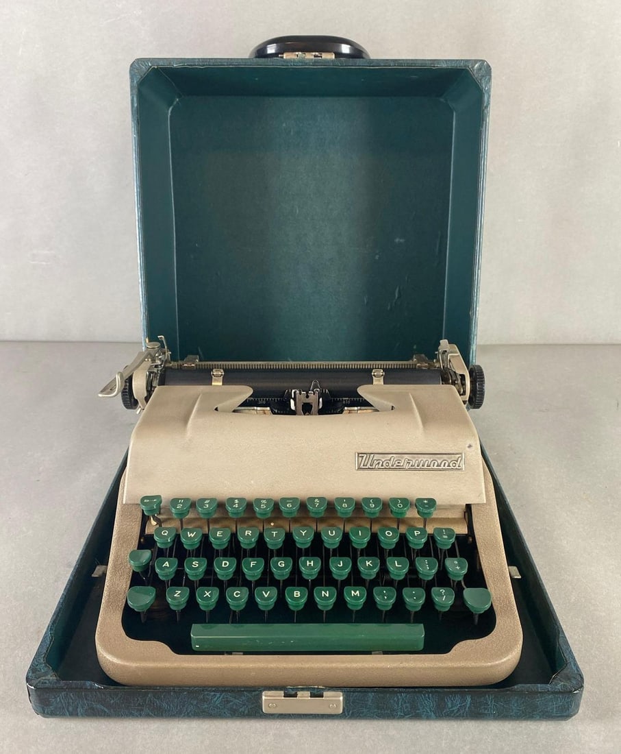 Underwood Typewriter with Carrying Case: Untested, With some ribbon, Some cracks in case, Measures 7 1/4 x 13 1/2 x 14 inches.