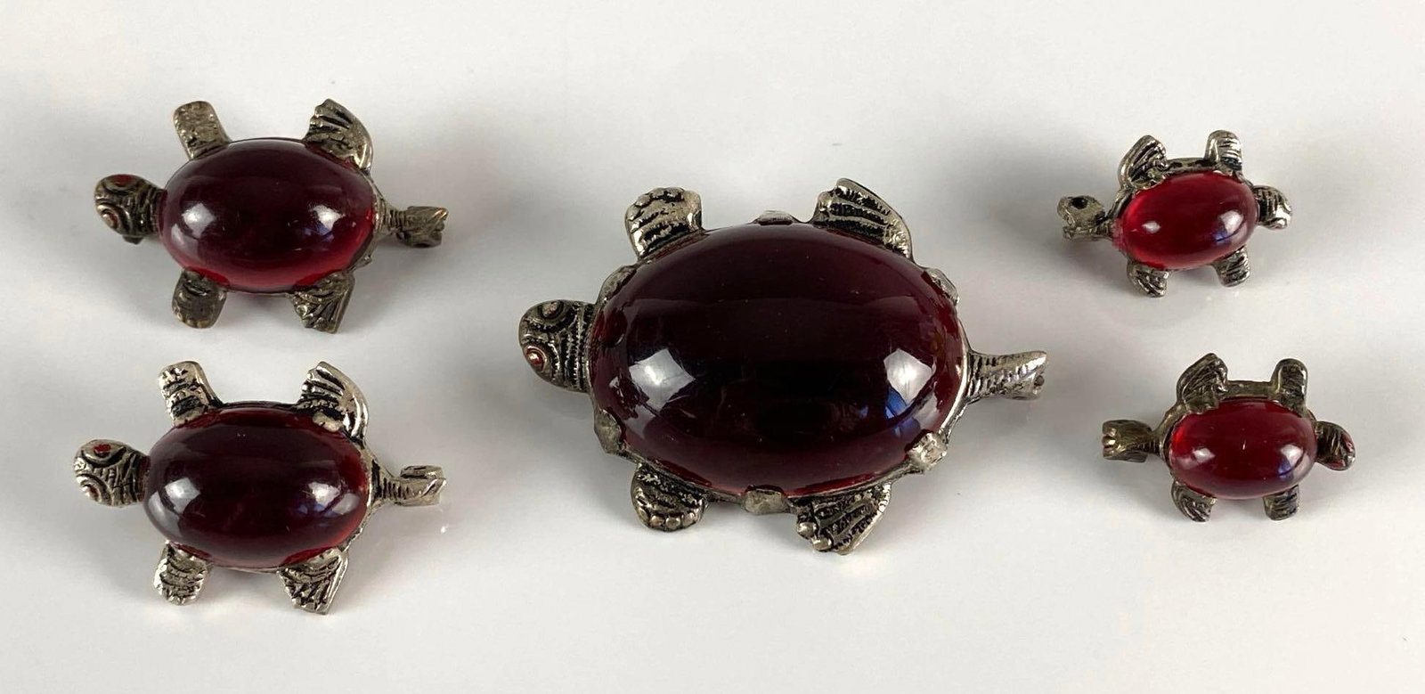 Group of 5 Red Shelled Turtle Brooches: One missing pin for clasp, Largest measures 1 3/4 x 1 1/4 inches.