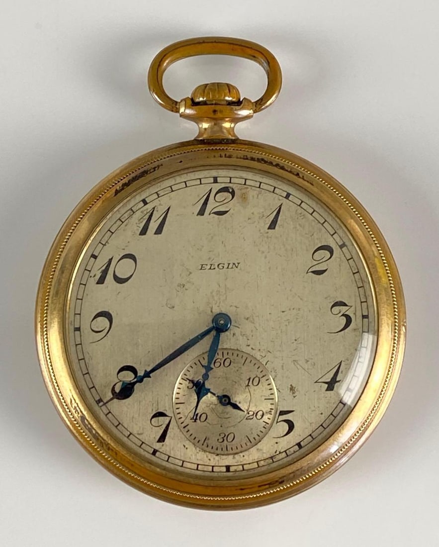 Elgin No. 563 Monogramed Pocket Watch: 10K Gold filled case, With original box, Watch Measures 2 1/2 x 2 inches.