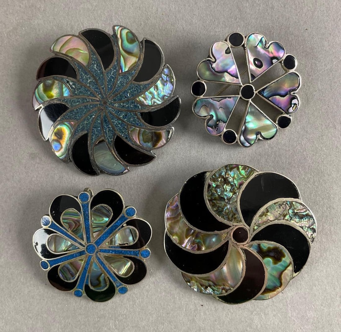 Group of 4 Sterling Silver and Abalone Brooches: Likely black onyx, .925 pure silver. Largest measures 1 3/4 inches. 31.3 grams total weight
