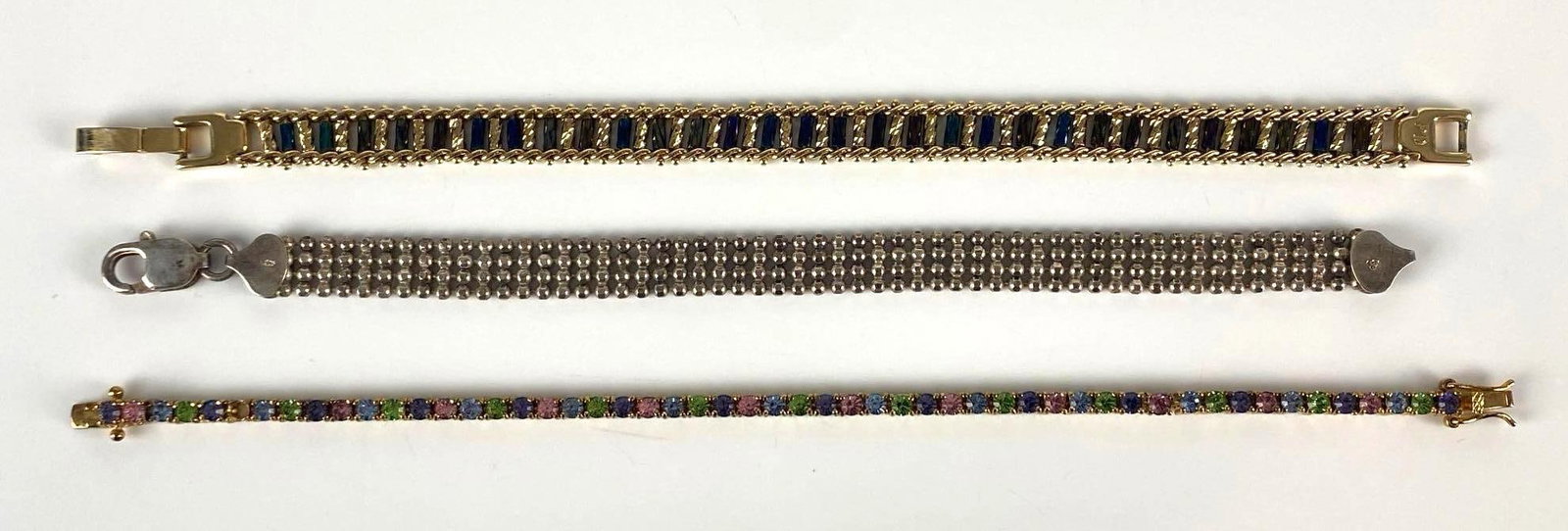 Group of 3 Sterling Silver Bracelets: Total weight 32.2g, Includes beaded, rhinestone, and other, Longest measures 7 1/2 inches long.
