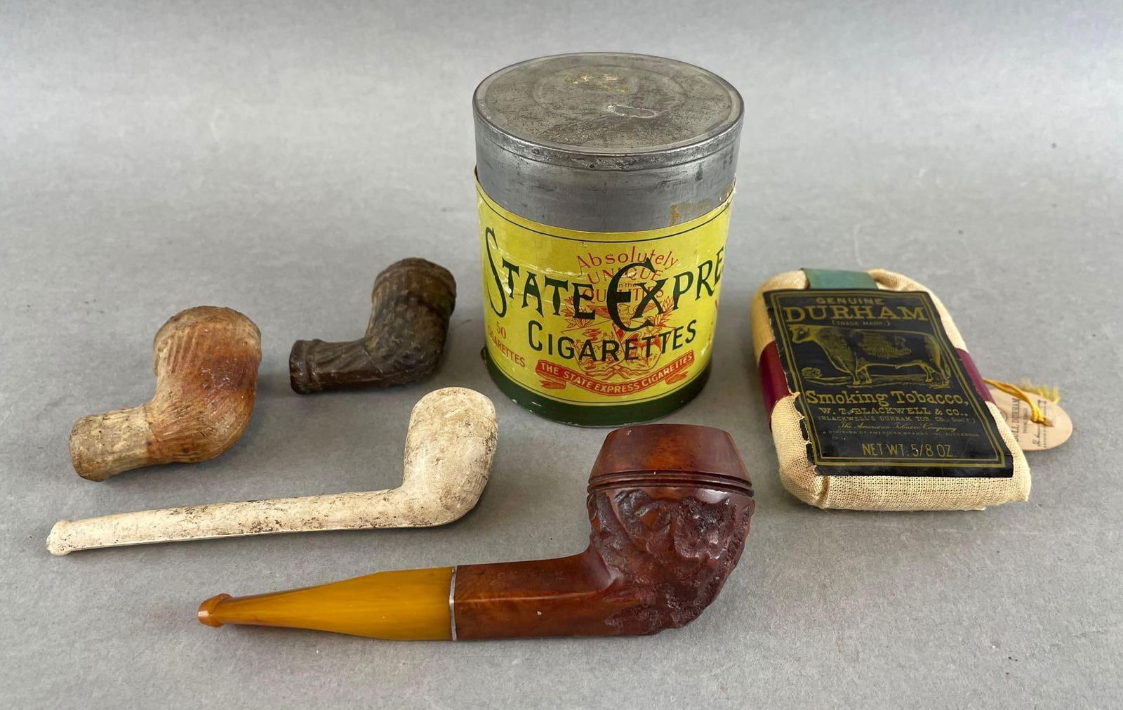 Group of Pipes and Tobacco Advertising Containers (1 of 3)