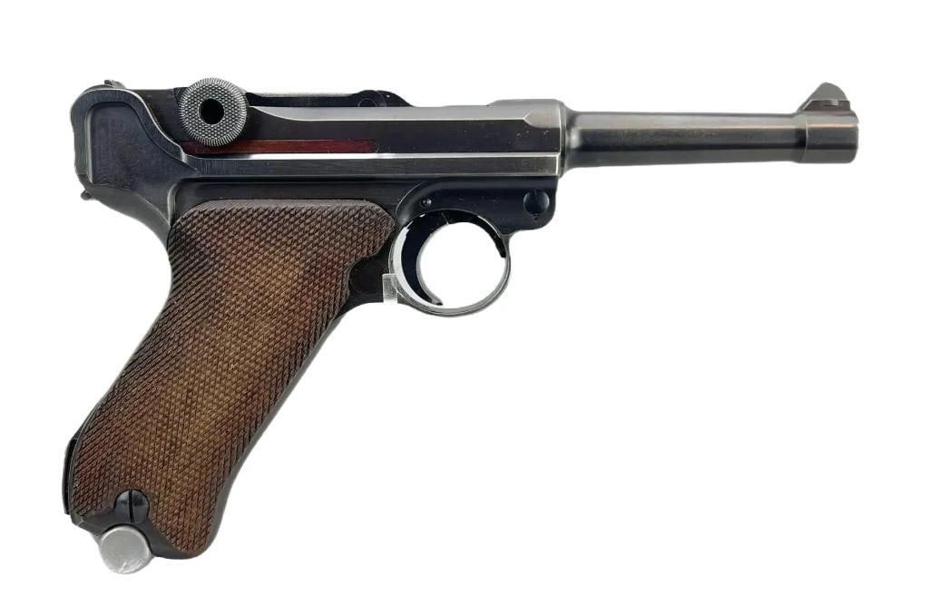 Identified Pre WW2 German 1939 Mauser Luger 9mm cal. Semi Auto Pistol with Holster: Serial Number 2073w. This is an example of a standard pre-WWII German Army Luger pistol as produced by the Mauser factory. It is dated "1939" over the chamber. It has the late production all blued met