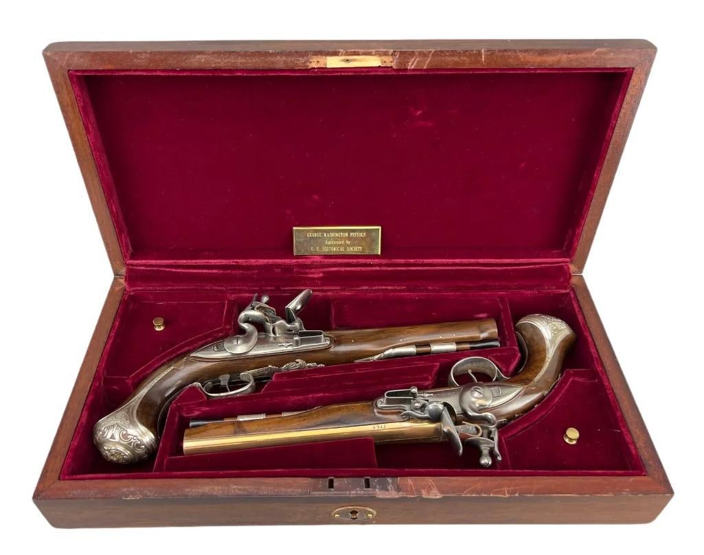 U.S. Historical Society George Washington Replica Pistol Set with Presentation Case: Consecutive Serial Number 775A and 775B, Manufactured in 1976, a silver mounted set from an edition of 975 paired working flintlocks made by Centaure of Liege, Belgium, the walnut stock of each .58 ca