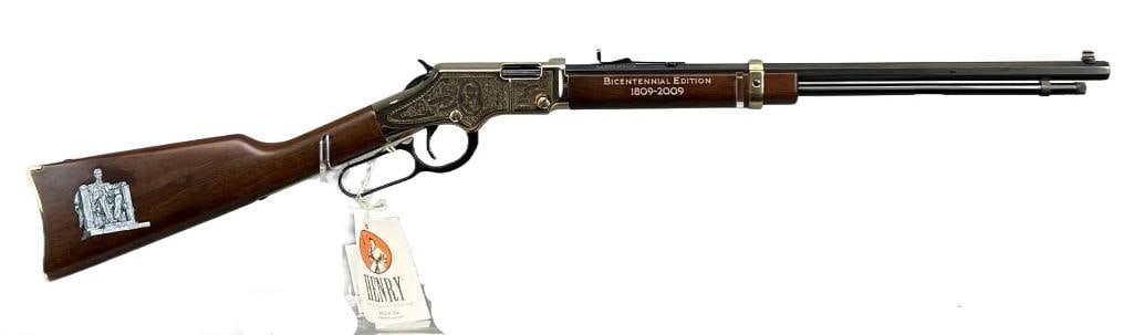 Henry Model H004AL Golden Boy Lincoln Bicentennial .22 S.L.LR. cal. Lever Action Rifle with: Serial Number AL0689, Made in 2009, New Condition with Original Box, Beautiful Engraved Receiver with Abraham Lincolns Portrait as will as a Engraved Wood Stock with an Image of The Lincoln Memorial i