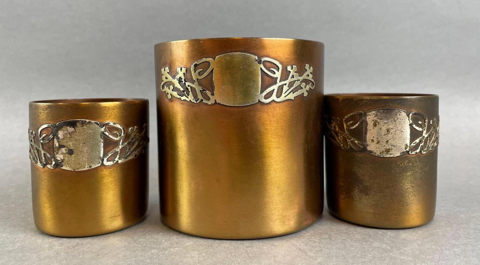 Set of 3 Heintz Sterling on Bronze Tumblers: Stamped on bottoms, largest measures 3 1/4 x 3 inches