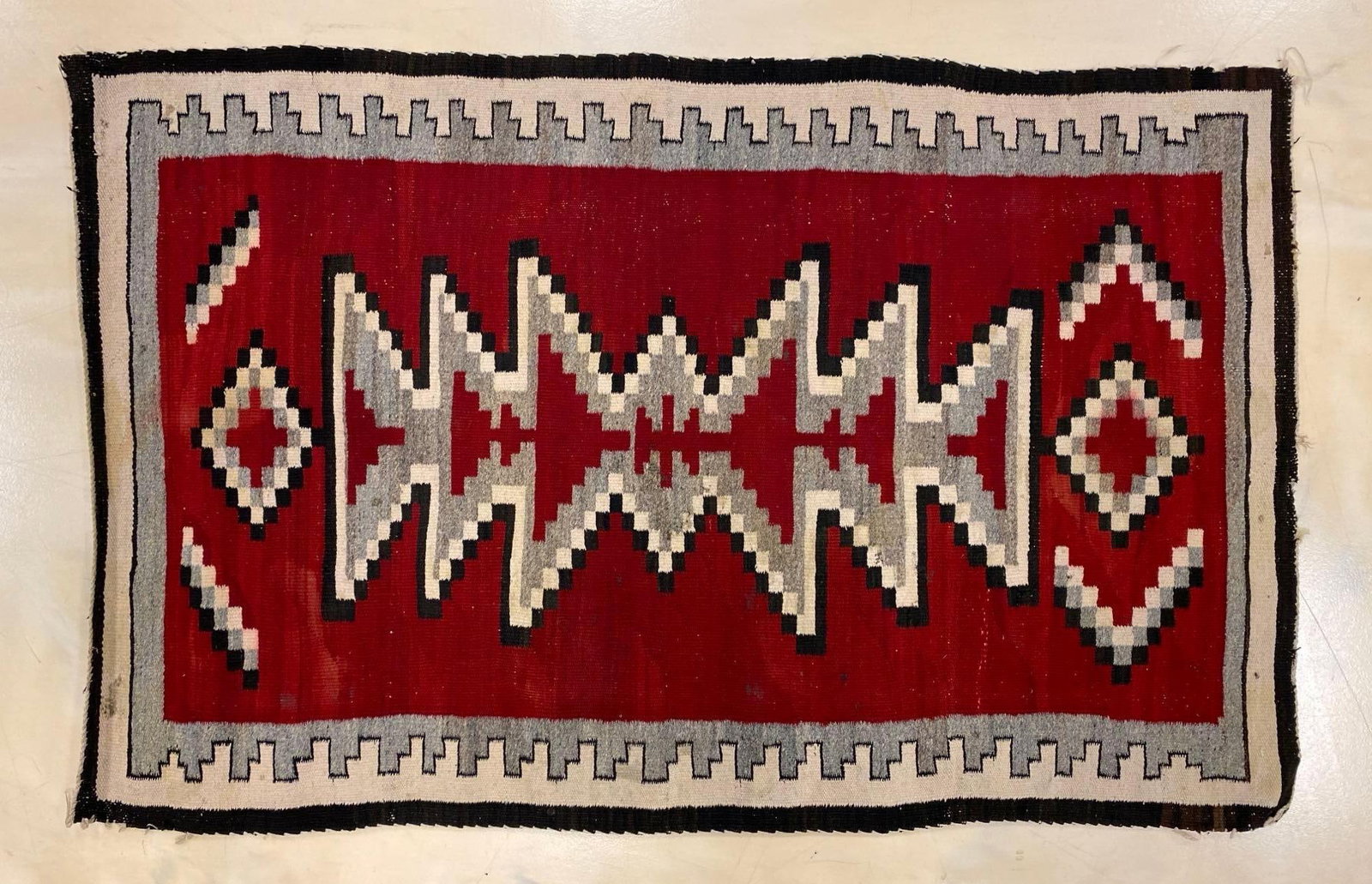 Native American Navajo Woven Wool Blanket: Some staining around edges, Measures 33 1/2 x 54 inches.
