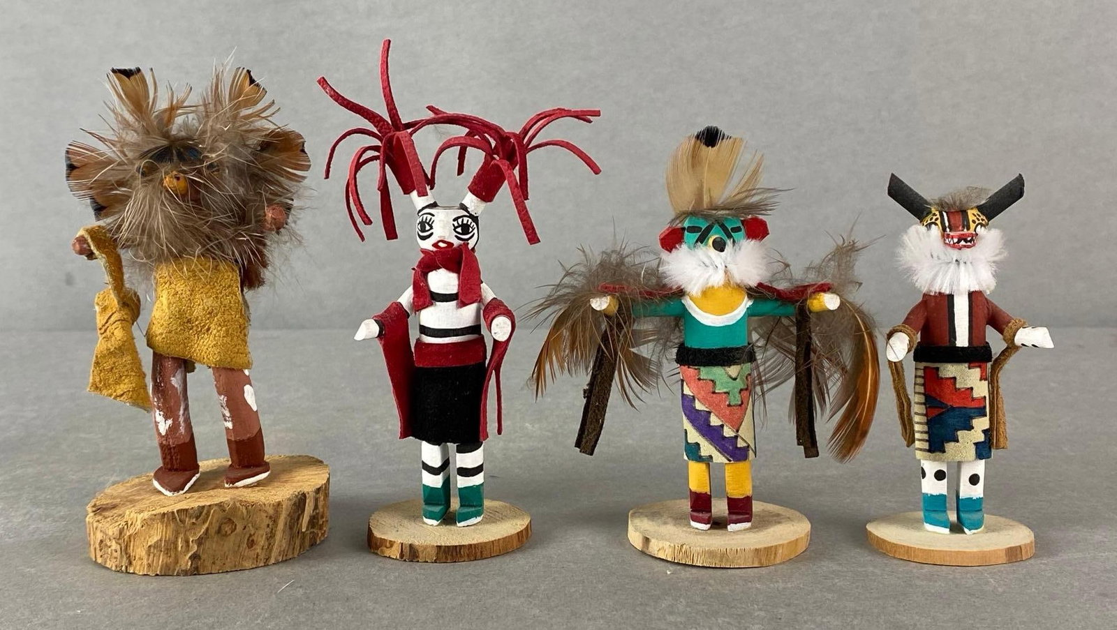 Group of 4 Miniature Native American Kachinas: Includes Brown Horned Owls, Clown, Eagle, and Chipmunk, Tallest measures 4 3/4 x 2 1/4 x 2 1/4 inches.