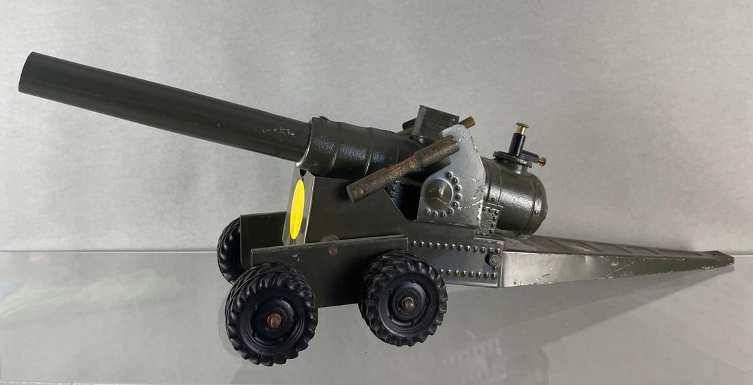 Big Bang Pressed Steel Toy Cannon: Pressed steel body, die-cast cannon. Measures 8 x 23 1/2 x 6 1/2 inches