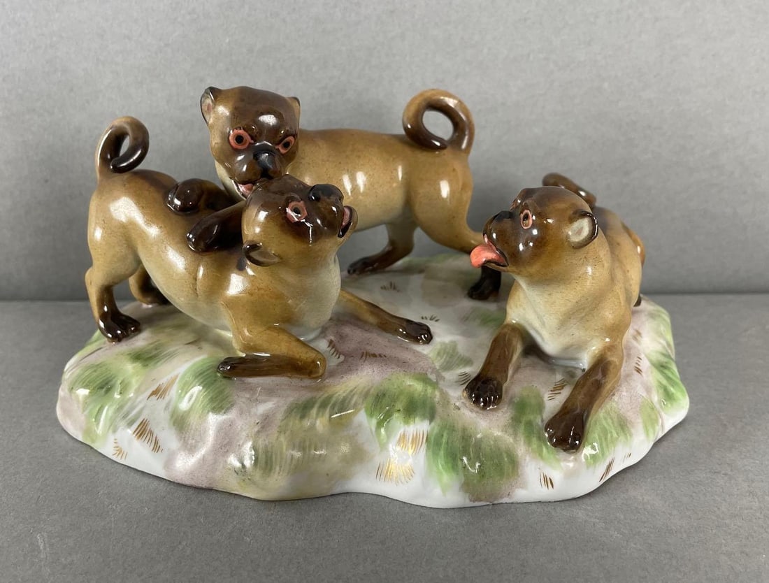 Meissen Porcelain Pugs Figurine: Marked on base. Measures 3 1/4 x 6 1/2 x 3 3/4 inches