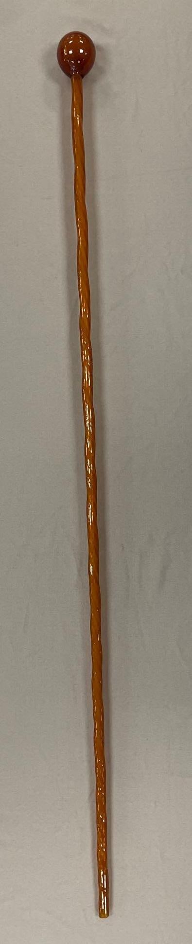 Amber Glass Cane: 3rd party shipper recommended. Measures 54 3/4 inches. Broken tip on end