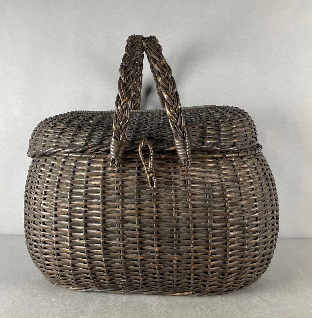 Wicker Basket with Lid and Handles: One rattan hinge broken. Measures 12 1/2 x 20 x 12 1/2 inches