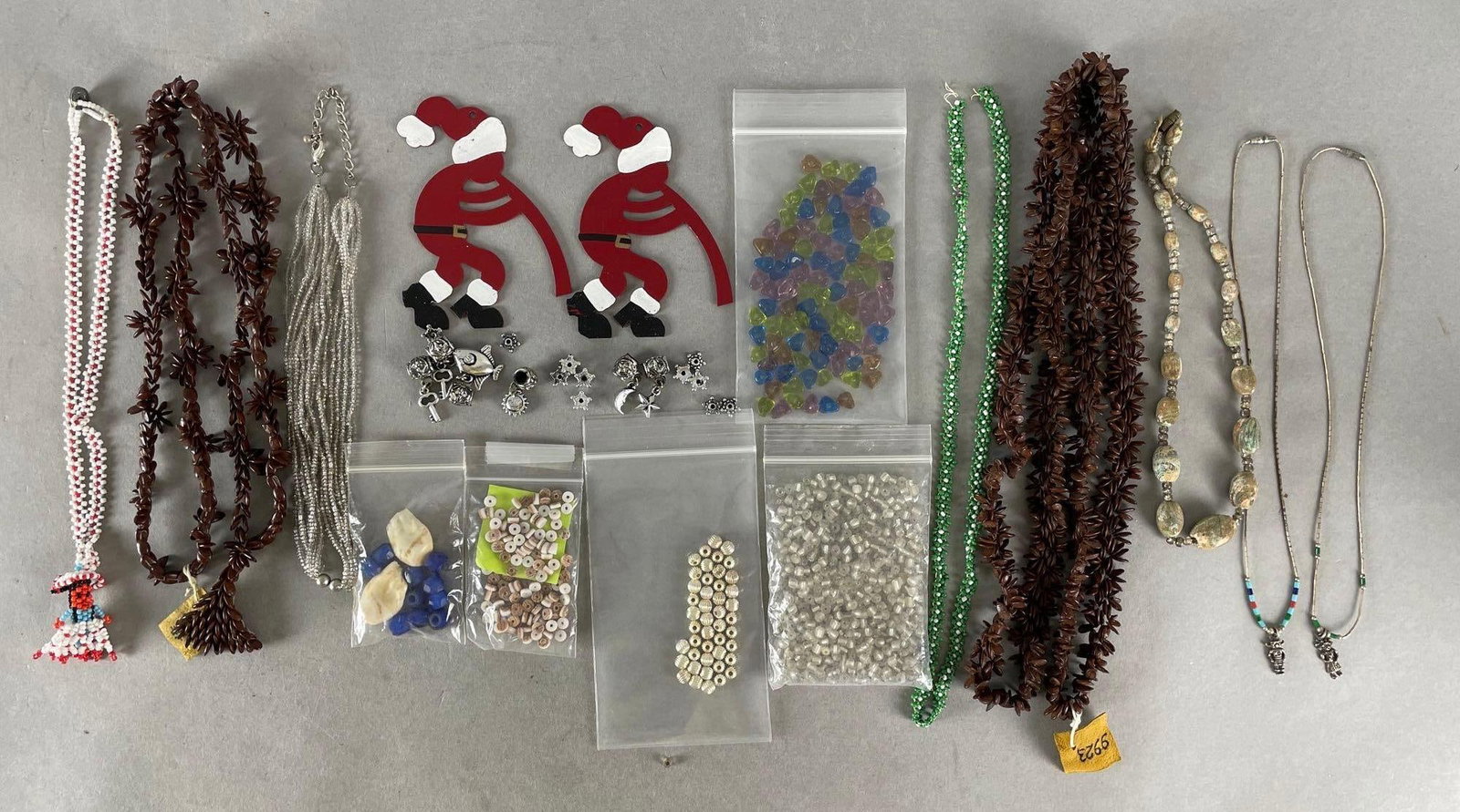 Group of Beaded Jewelry and More: Includes Native American, seed beads, Christmas kokopellis. Longest necklace measures 46 inches