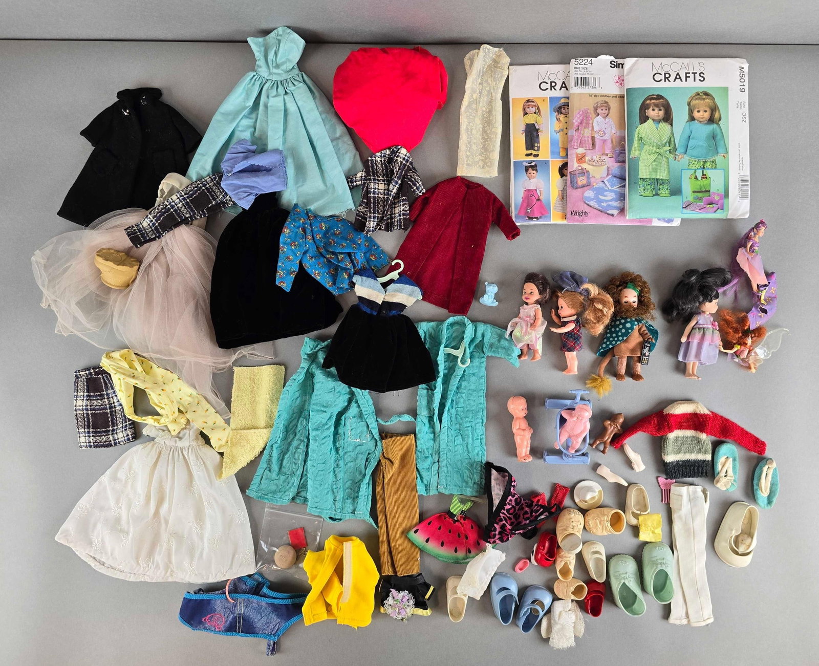 Group od McCalls Crafts Dolls and More: Includes clothing, dolls, shoes and more. Largest measures 10 x 7 inches