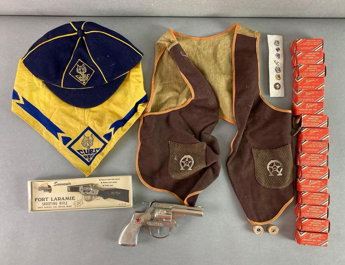 Group of 20+ Toy Cap Guns and More: Includes cap guns, cub scouts hats and handkerchief, kids cowboy vest and more, cap gun ammunition includes original box, vest measures 16 x 12 inches