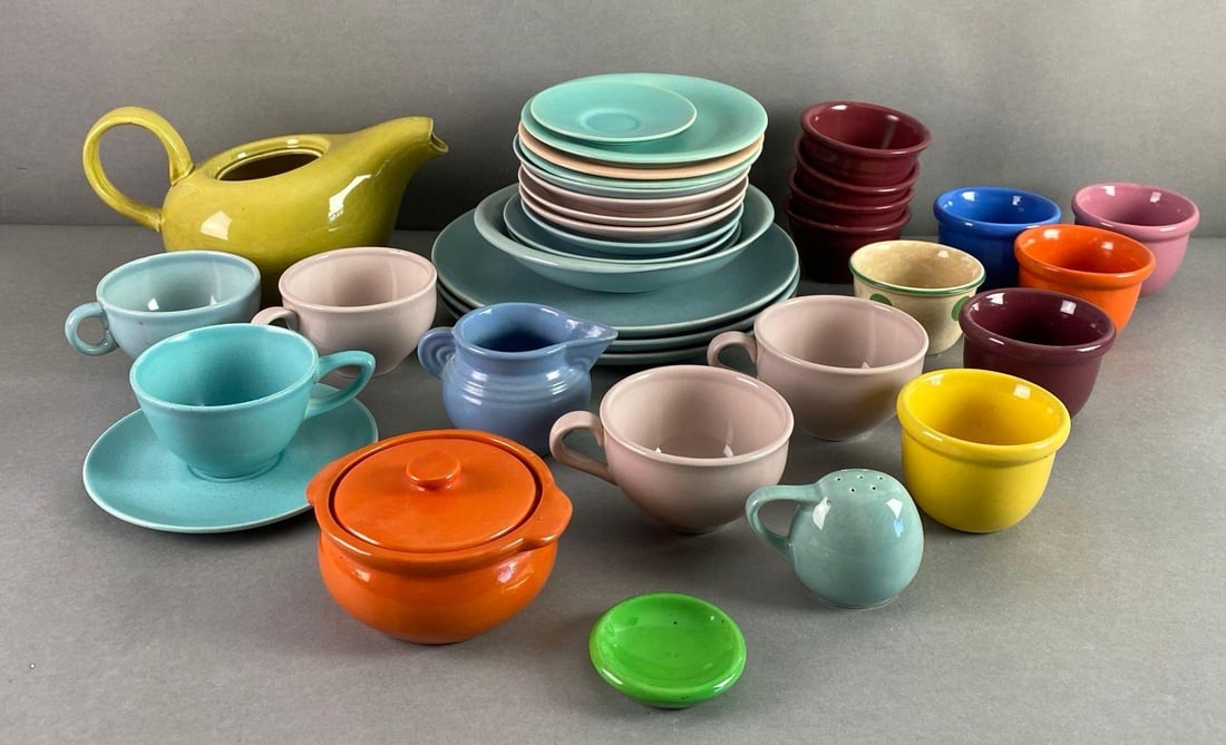 Group of Fiesta Ware Style Dishes and More: Includes some Russel wright, includes pitchers, plates, bowls and more, largest pitcher measures 5 1/4 x 9 x 6 1/2 inches