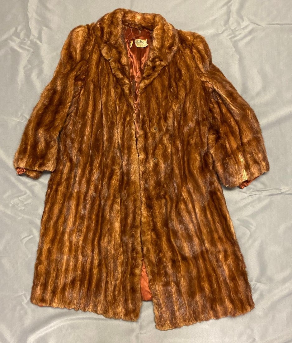 Phudlik Brothers Mink Coat: Tearing along neck, shoulder to shoulder measures 17 inches, shoulder to cuff measures 25 1/2, neck to bottom measures 40 inches