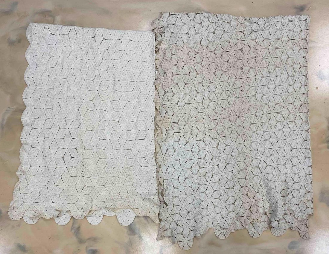 Group of 2 White/Off White Woven Blankets: Folded in photos, Some staining and discoloration on both, Largest measures 100 x 67 inches.