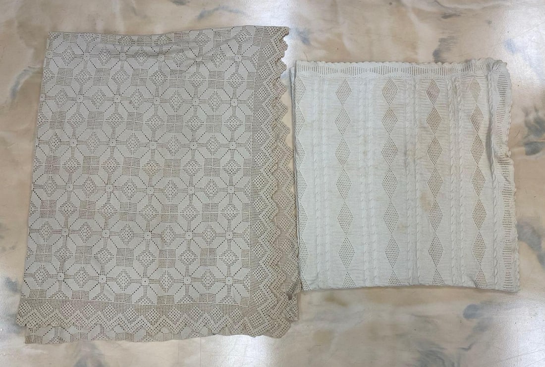 Group of 2 White Cotton Woven Blankets: Folded in photos, Some staining and discoloration around edges, Largest measures 105 x 84 inches.