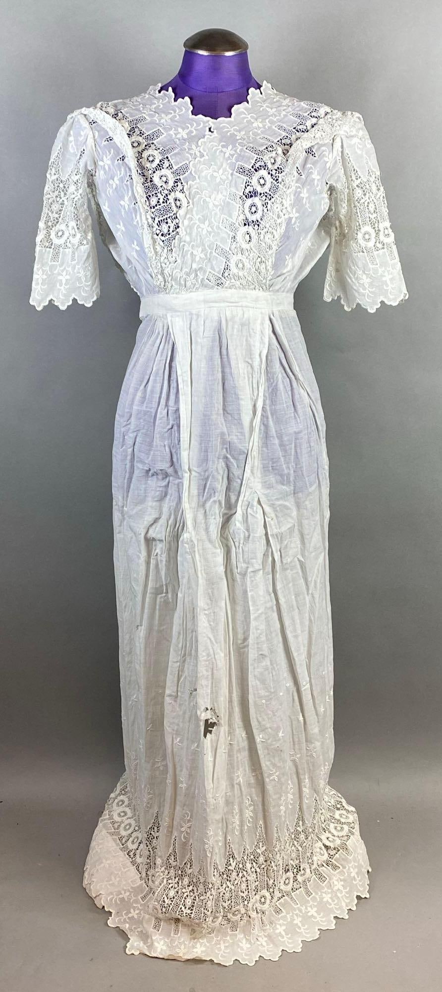 Victorian White Lace Petticoat: Scalloped high neckline, Large hole on center of front skirt, Does clasp all the way up (mannequin too large), Shoulder to shoulder measures 15 1/2 inches, Overall length 53 inches.
