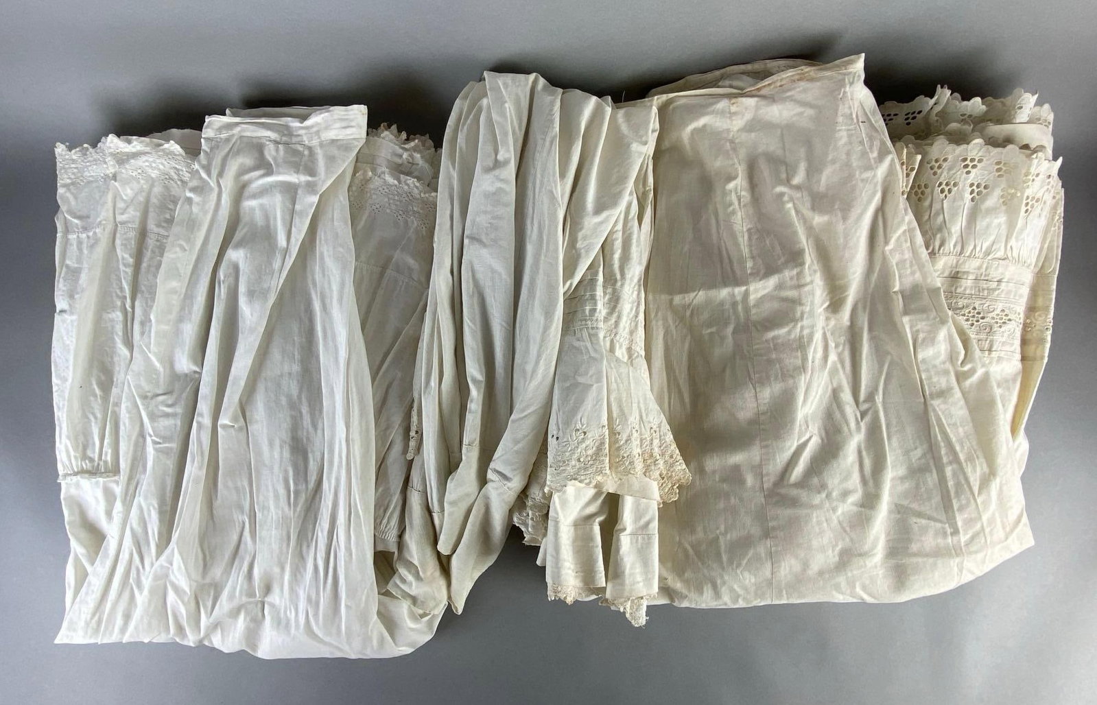Group of 3 Antique Womans White Petticoat Skirts: Some staining on all, Largest measures 42 inches long.