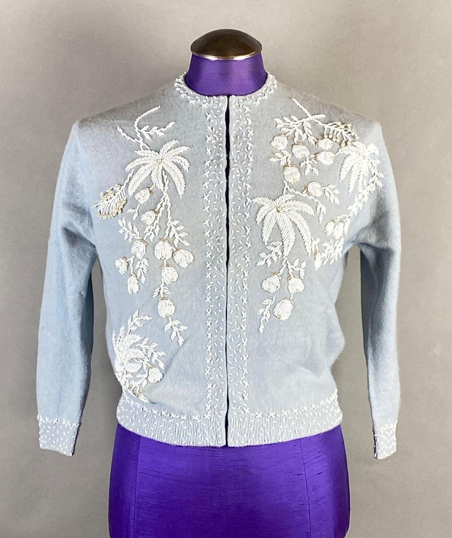 Barbra Lee Lambs Light Blue Wool Beaded Cardigan Sweater: Shoulders to shoulder measures 15 1/2 inches, Shoulder to cuff measures 18 inches, Collar to hem measures 16 1/2 inches.
