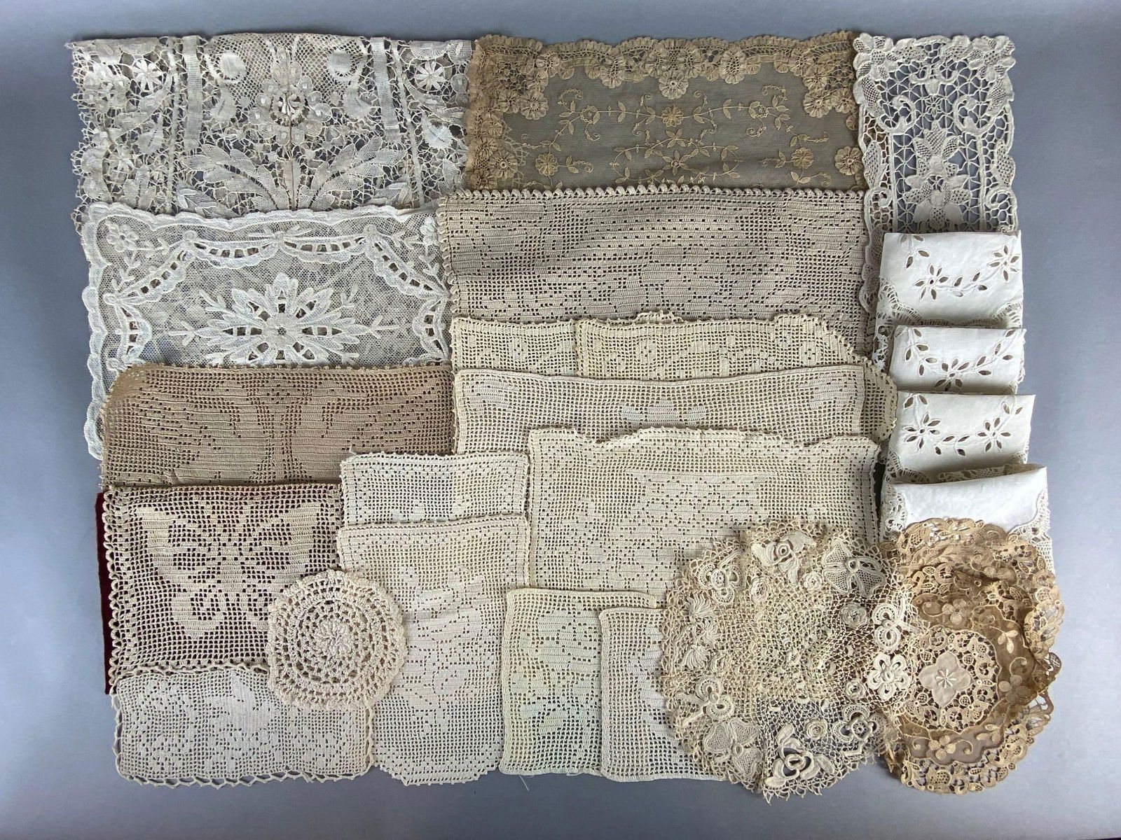 Group of 20+ Lace Doilies: Includes round and rectangular shaped doilies, Largest measures 12 x 14 inches.