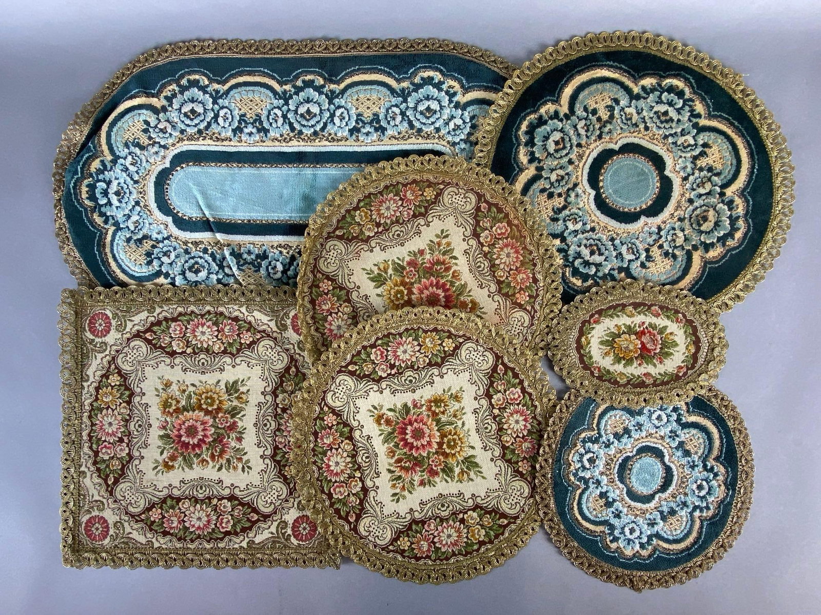 Group of 7 Needlepoint Brocade Doilies: Largest measures 22 1/2 x 14 inches.