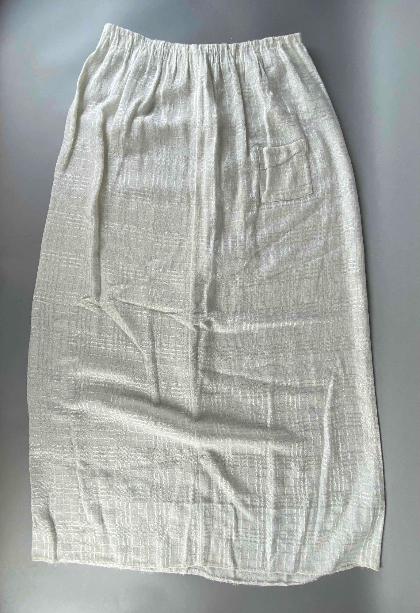 White Linen Womans Skirt with Front Pocket: Snap and hook closure up back, Waist measures 30 inches around, Measures 39 inches long.