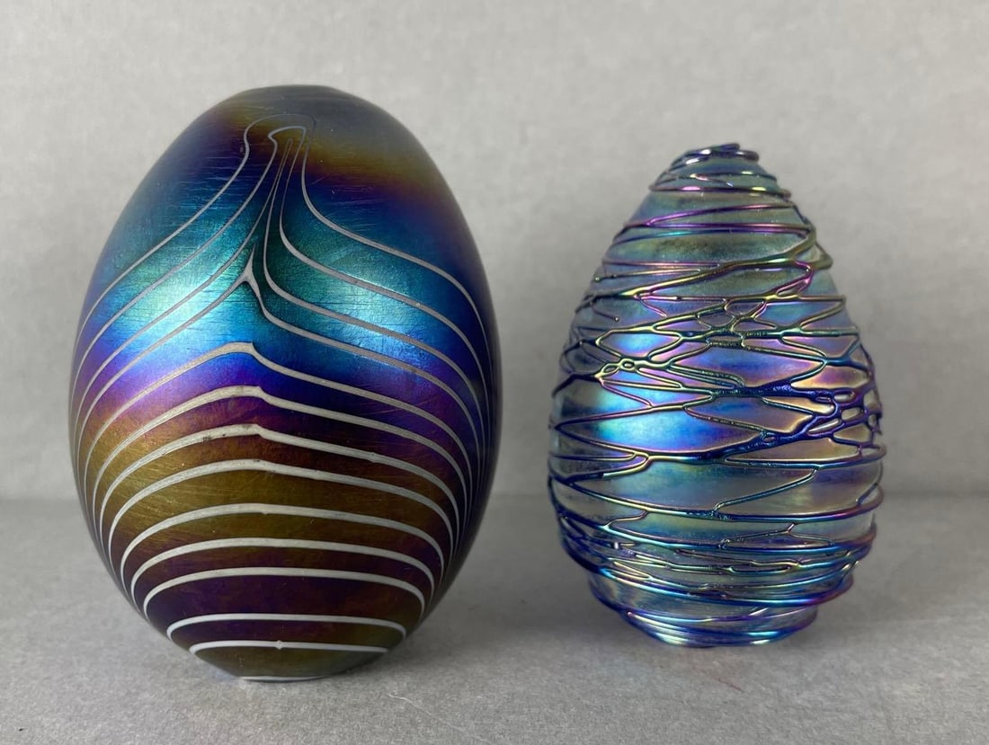 Group of 2 Iridescent Glass Egg Paperweights: Largest measures 3 x 2 1/4 inches