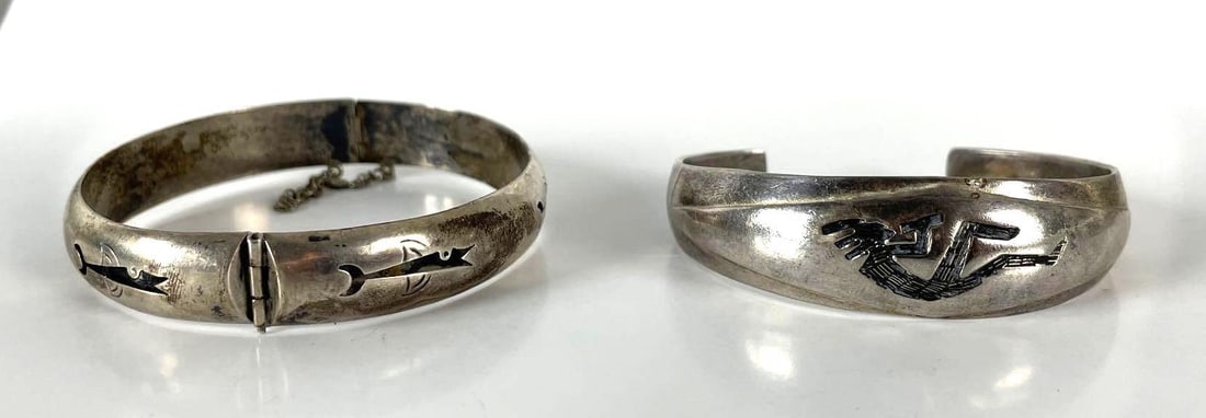 Group of 2 Sterling Silver Native American Dangle Bracelets: 32.5 g total weight. Includes sterling silver fish bracelet, and kokopelli. Largest measures 2 1/2 inches