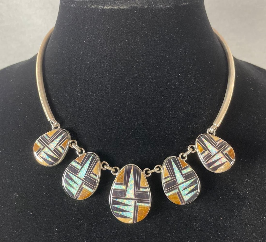 HT Sterling Native American Inlaid Necklace: Includes opal, onyx, and either petrified wood or tigers eye. Stamped on back. Measures 15 inches