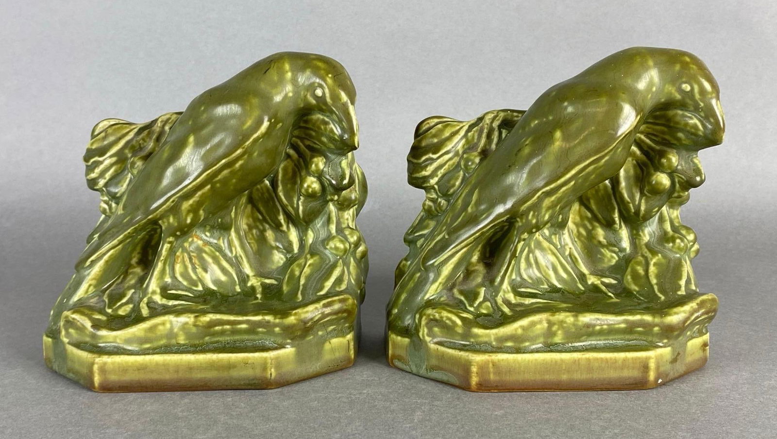 Pair of Rookwood Green Glazed Pottery Rook Bookends: Arts and Crafts, Both measure 5 1/4 x 5 1/2 x 3 1/4 inches.