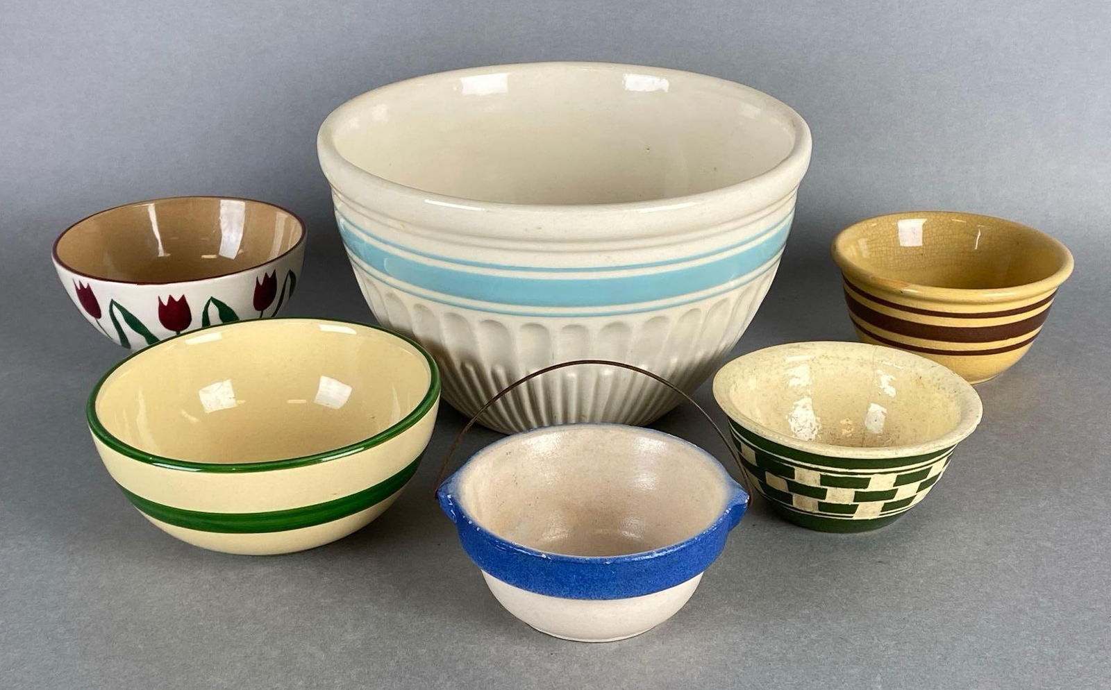 Group of 6 Stoneware Bowls: Includes Hullware, Mosse, and more, Some small chips, Largest bowl measures 4 1/2 x 7 1/2 x 7 1/2 inches.