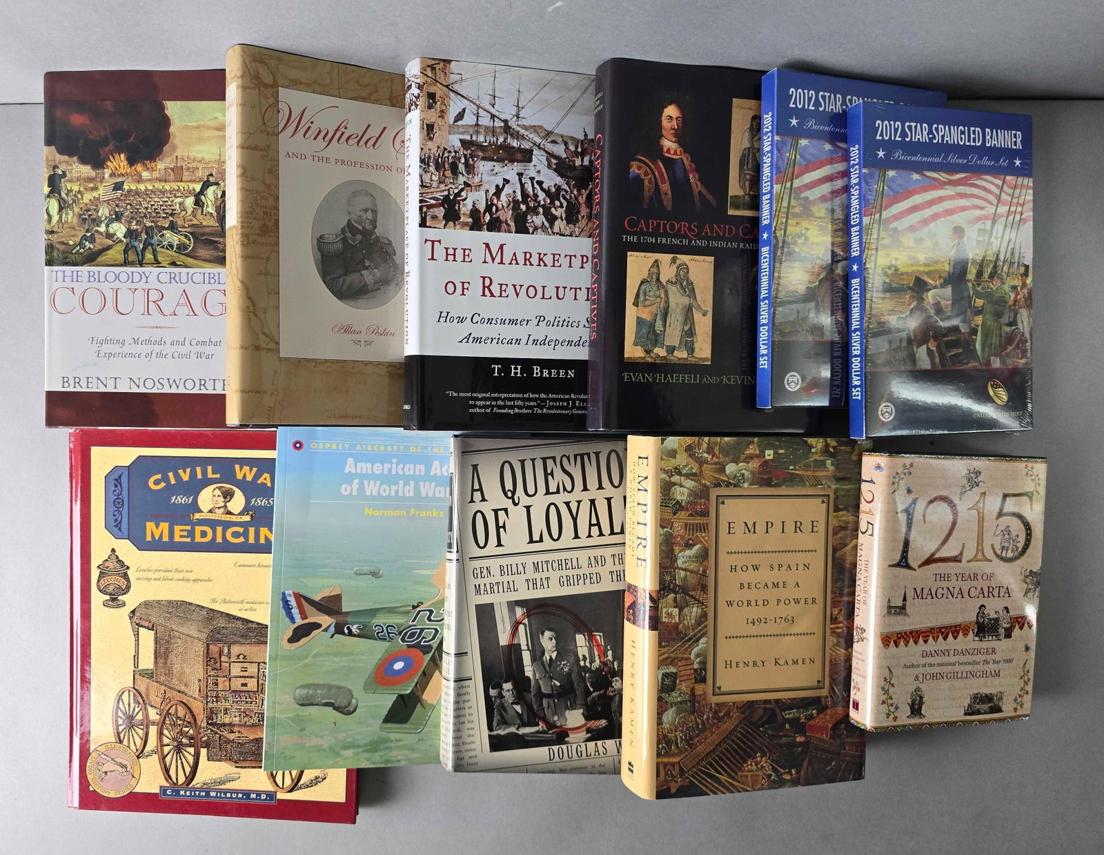 Group of 11 Informational Books and More: Includes 1215 the year if magna carta, 2012 star spangled banner, Civil War Medicine and more, largest measures 11 1/2 x 9 inches