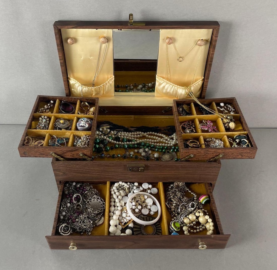 Jewelry Box of 60+ Vintage Costume Jewelry: Includes brooches, necklaces, earrings, bracelets, and more. Box measures 5 1/4 x 14 x 8 1/4 inches