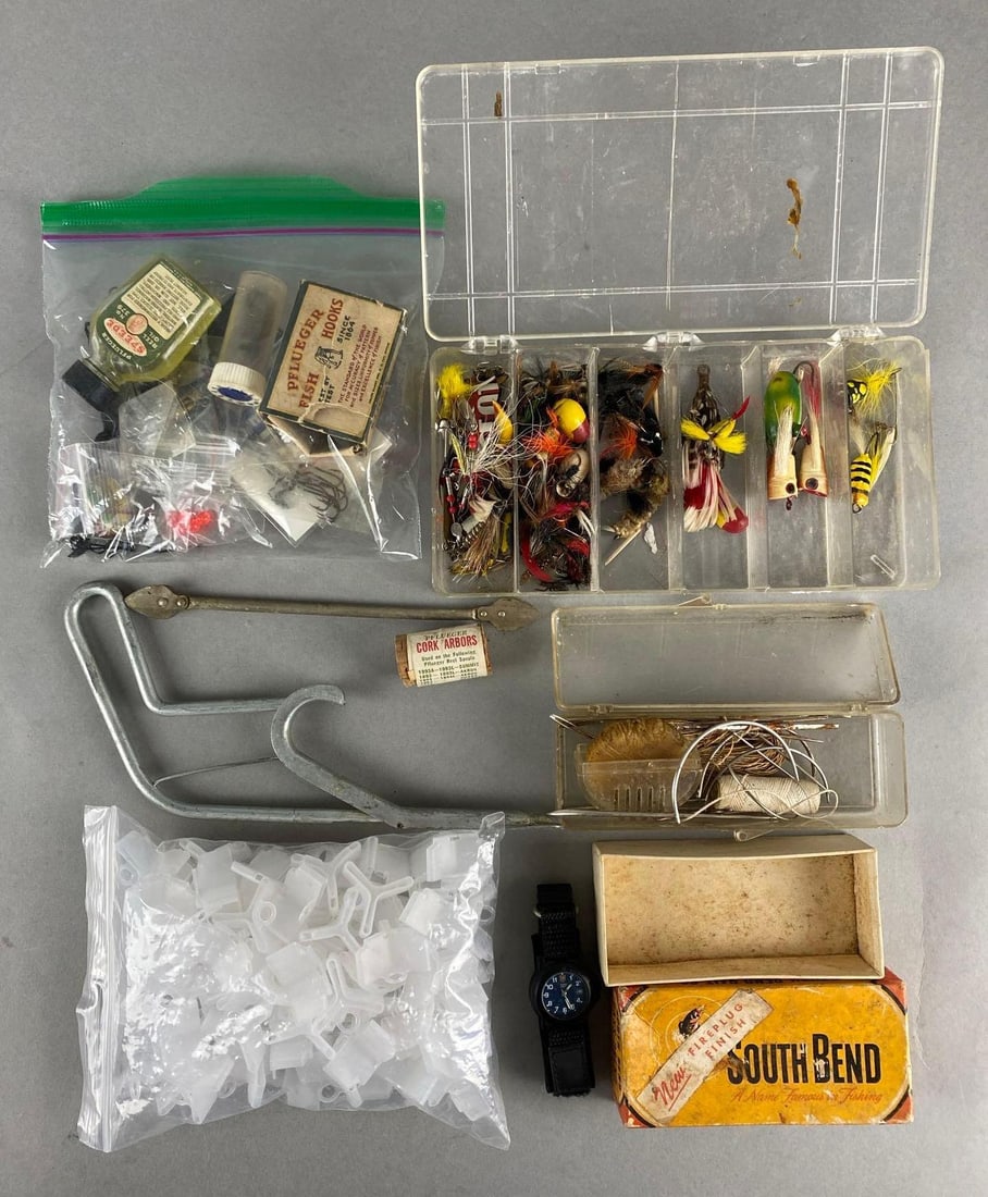 Group of Fishing Lures and More: Includes lures, fishhook covers, reel oil, and more.