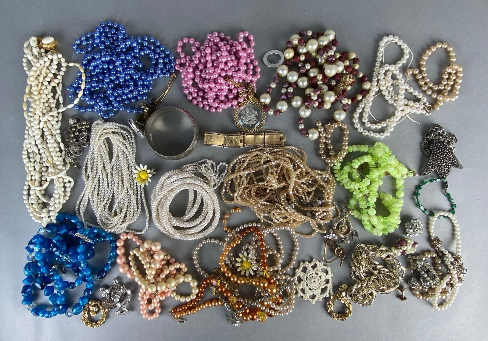 Group of Assorted Costume Jewelry Necklaces and More: Includes necklaces, bracelets, pins, and more, Including beaded, faux pearl, chain, and more.