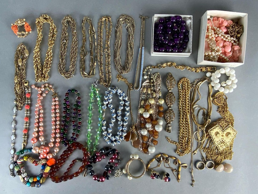 Group of 30+ Costume Jewelry Items: Includes necklaces, bracelets, earrings, and more, Including chains, beaded, rhinestone, and more.