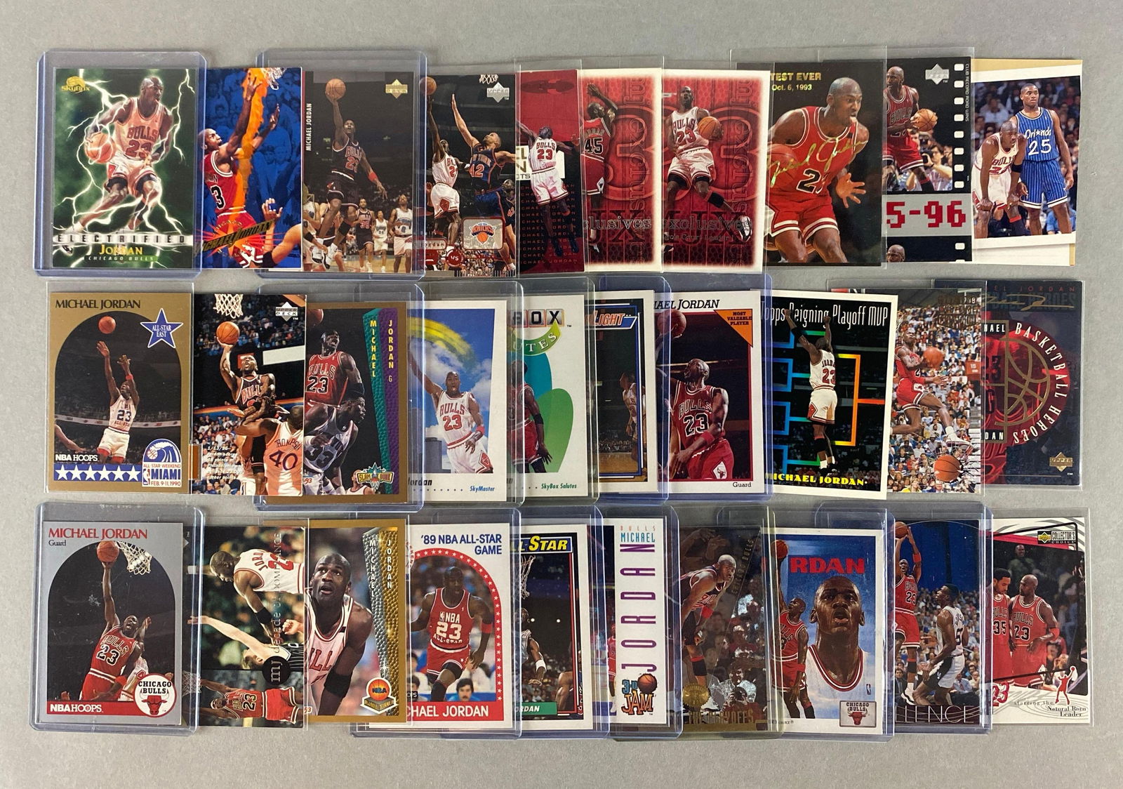 30 - Michael Jordan Cards: 1995 Skybox Michael Jordan #15, 1996 Skybox Electrified #278, 1995 Upper Deck Major Attractions Michael Jordan and Charlie Sheen #339, and Many More
