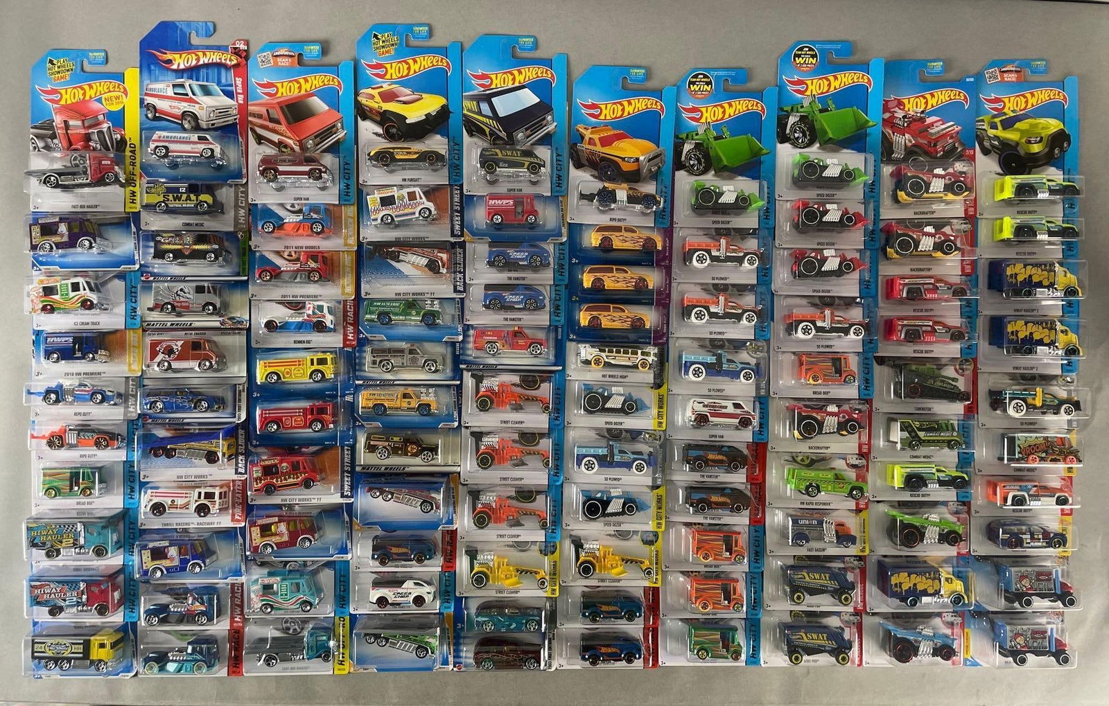 Group of 100+ Mattel Hot Wheels Die-Cast Trucks: Includes speed dozer, rescue duty, box trucks, tanknator, and more