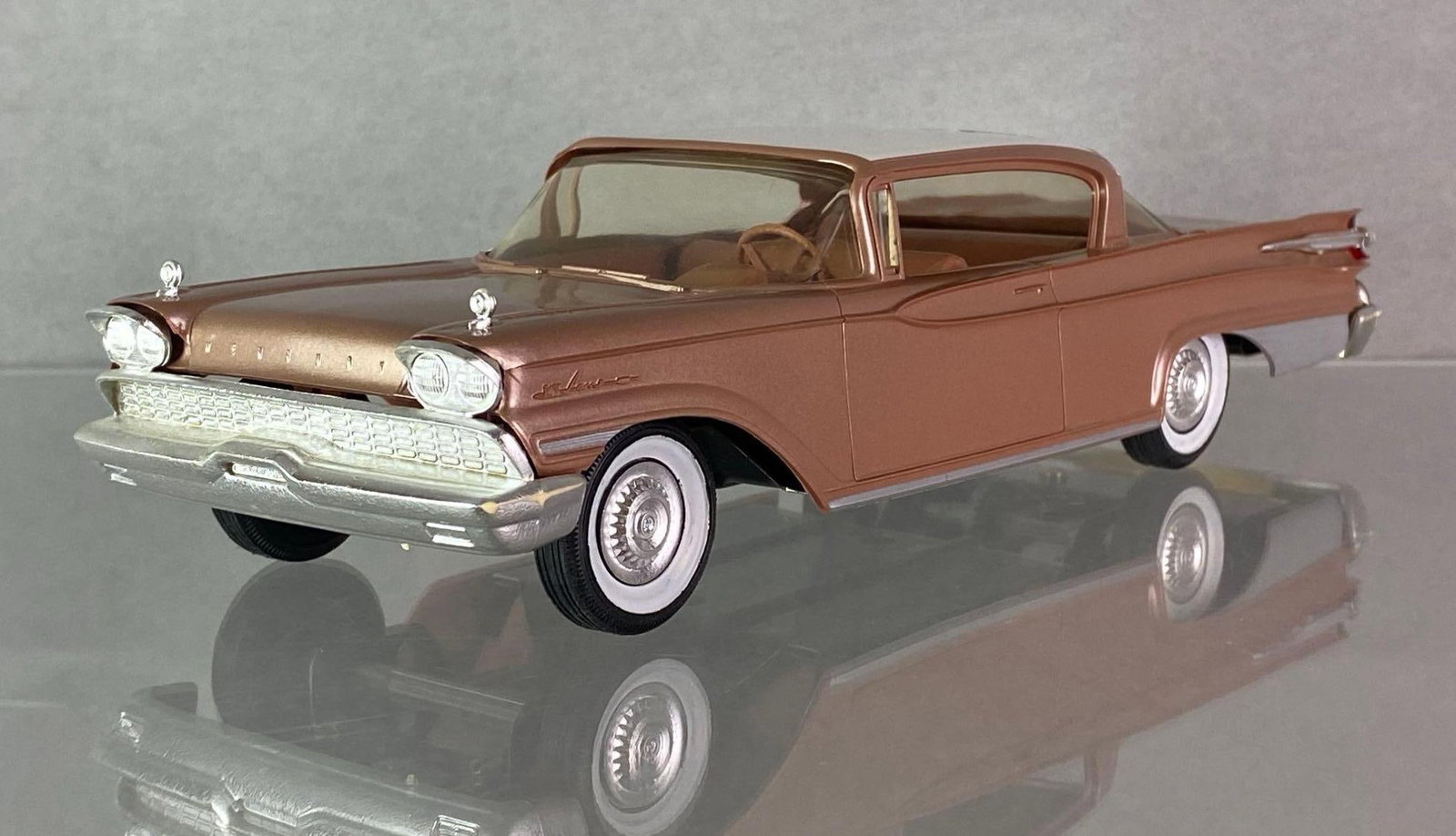 1959 Mercury Park Lane Bronze/Beige Promo Car: 1/25 scale, AMT Corp, With friction, With original box, Some tears and missing pieces on box.