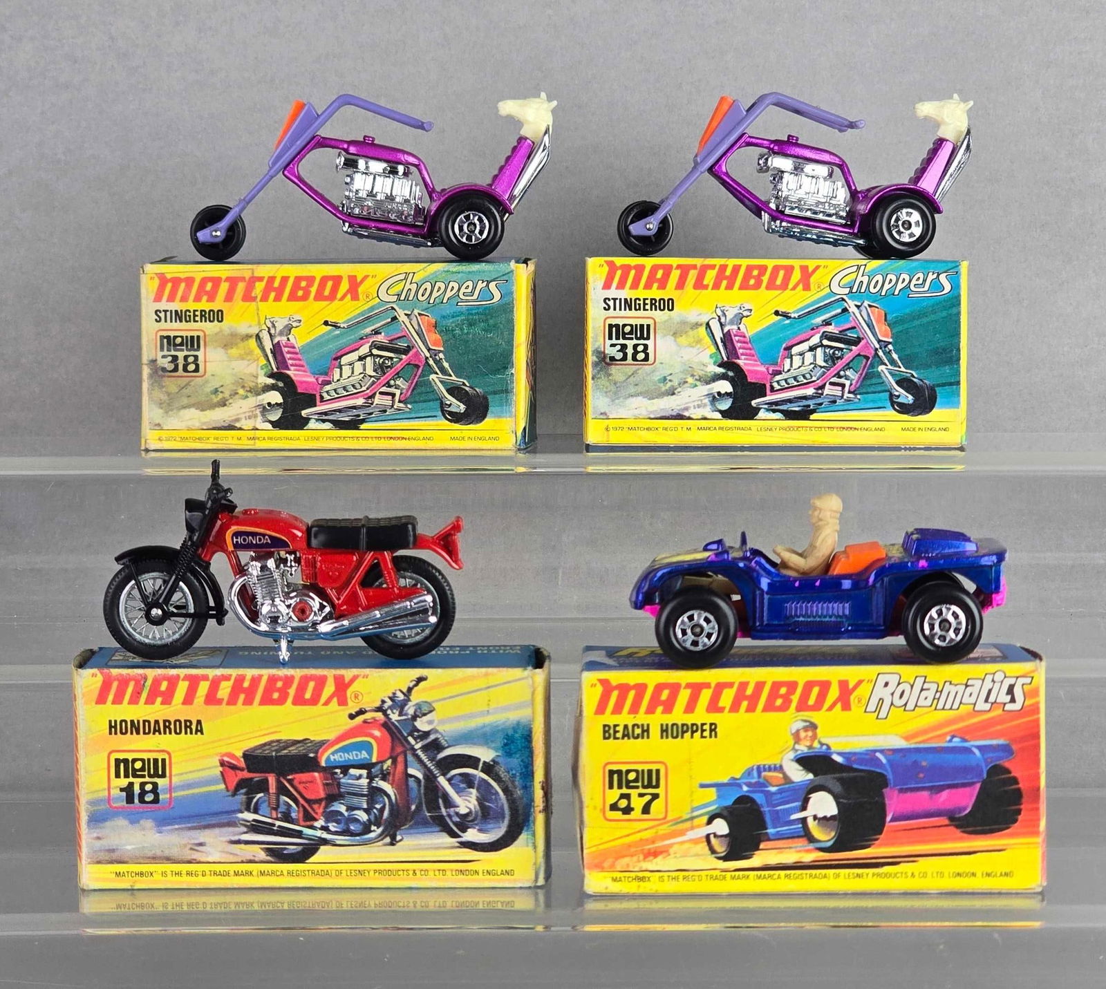 Group of 4 Matchbox No. 38, 18 and 47 Die-Cast Motorcycles and Car: With boxes, A Lesney Product, made in England, Color: Red, blue and purple, no windows, Pink bases, black plastic wheels, damaged flaps on boxes
