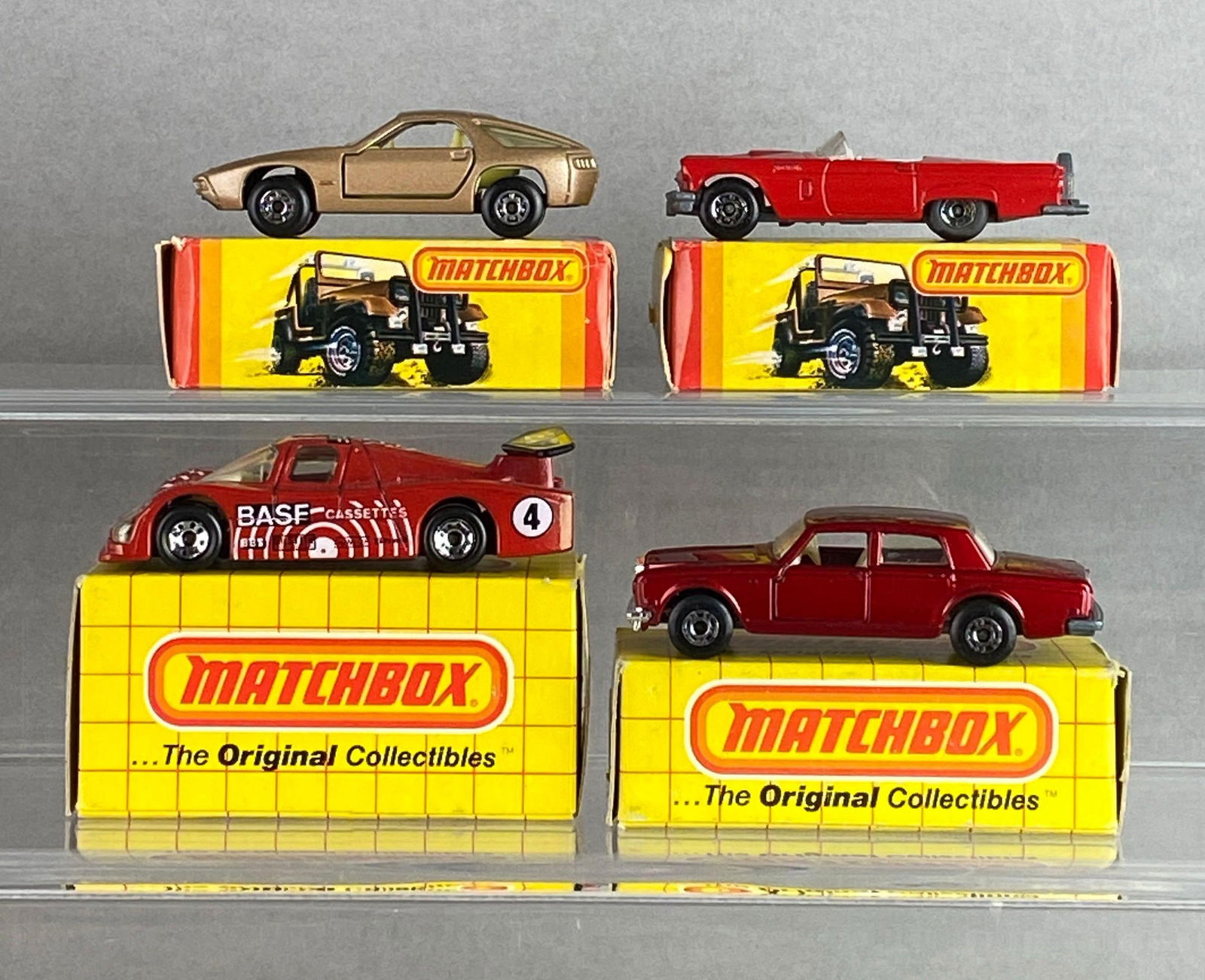 Group of 4 Matchbox No. 66, 38, 55 and 42 Die-Cast Cars: With boxes, A Lesney Product, made in England, Color: Tan and red, clear windows, silver and black bases, black plastic wheels