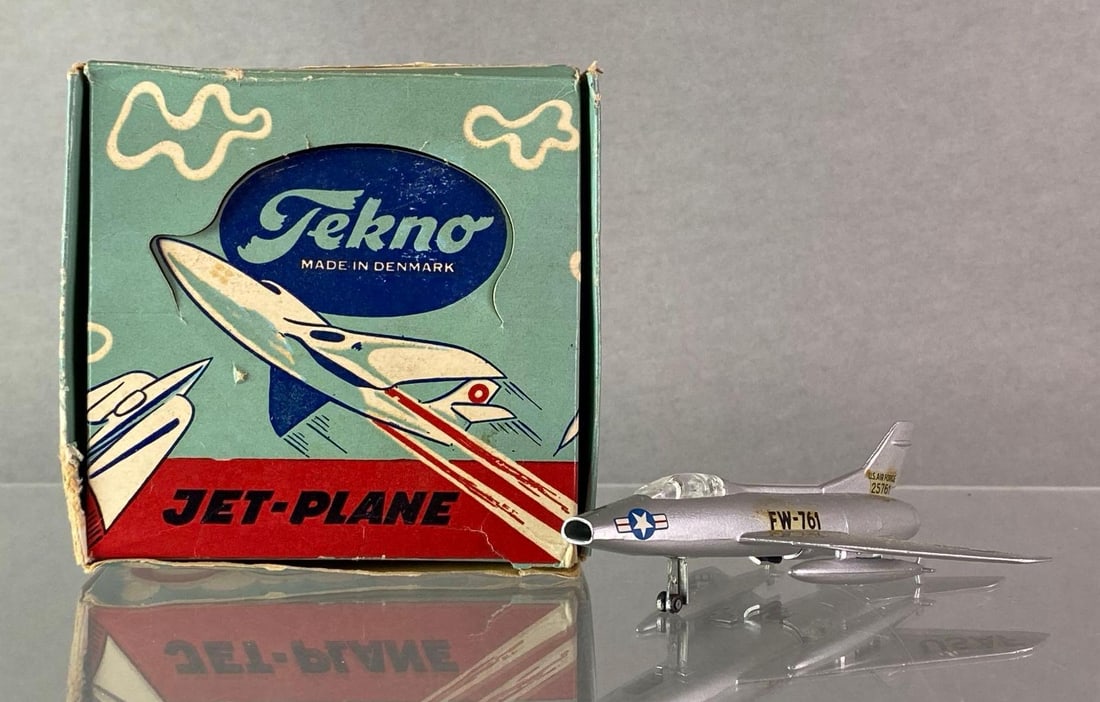 Tekno No. 787 North American Super Sabre AMC Jetfighter: 1/125 scale, Made in Denmark, With original box, Body: Silver, Die-Cast, Some tears in box, Box measures 4 1/4 x 4 1/4 x 1 3/4 inches.