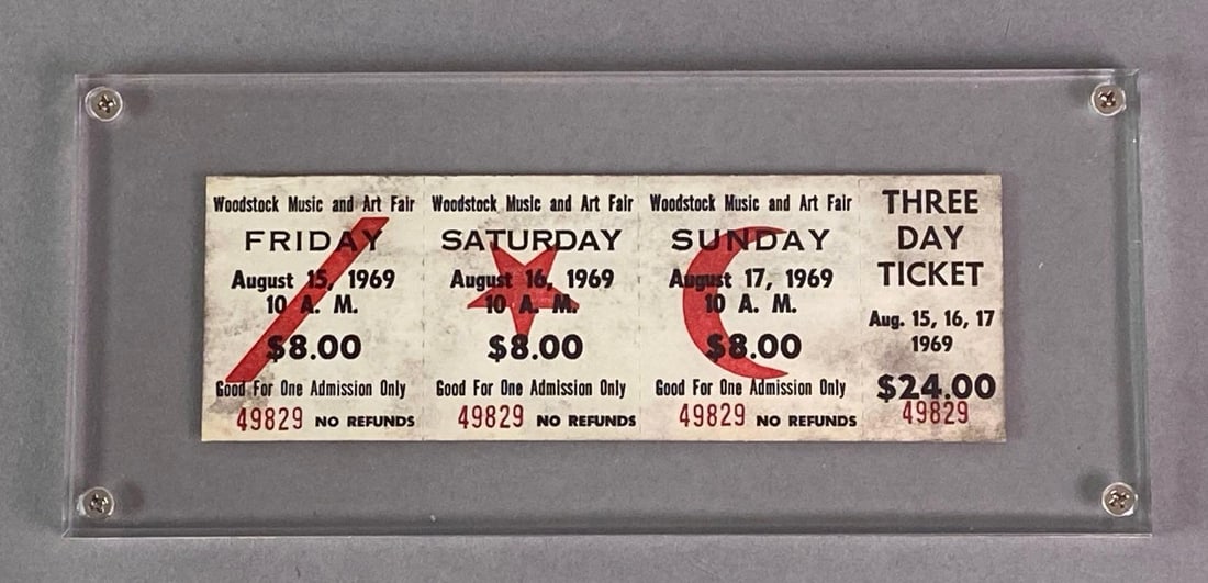 Original 1969 Woodstock 3-Day Ticket: With Globe Ticket Company COA, No. 49829, Unused, Mounted behind plexiglass, Measures 3 1/2 x 8 inches.