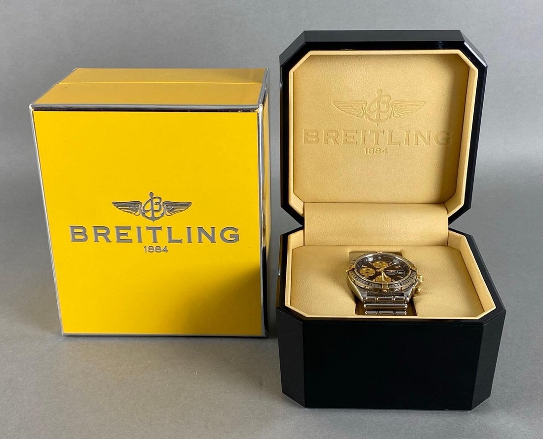 Breitling Chronometere Automatic Mens Wristwatch: In working condition, B13352, With original Bakelite box, Letters loose from main box, Largest box measures 5 x 6 x 3 3/4 inches.