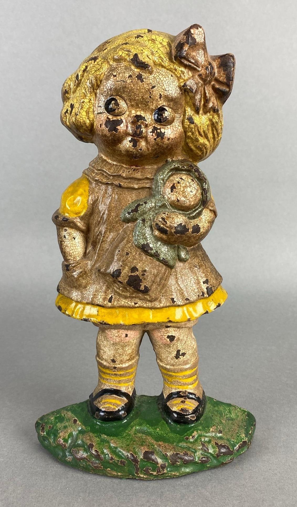 Hubley Dolly Dimple Cast Iron Doorstop: Crazing throughout, Measures 9 1/2 x 5 3/4 x 2 inches.