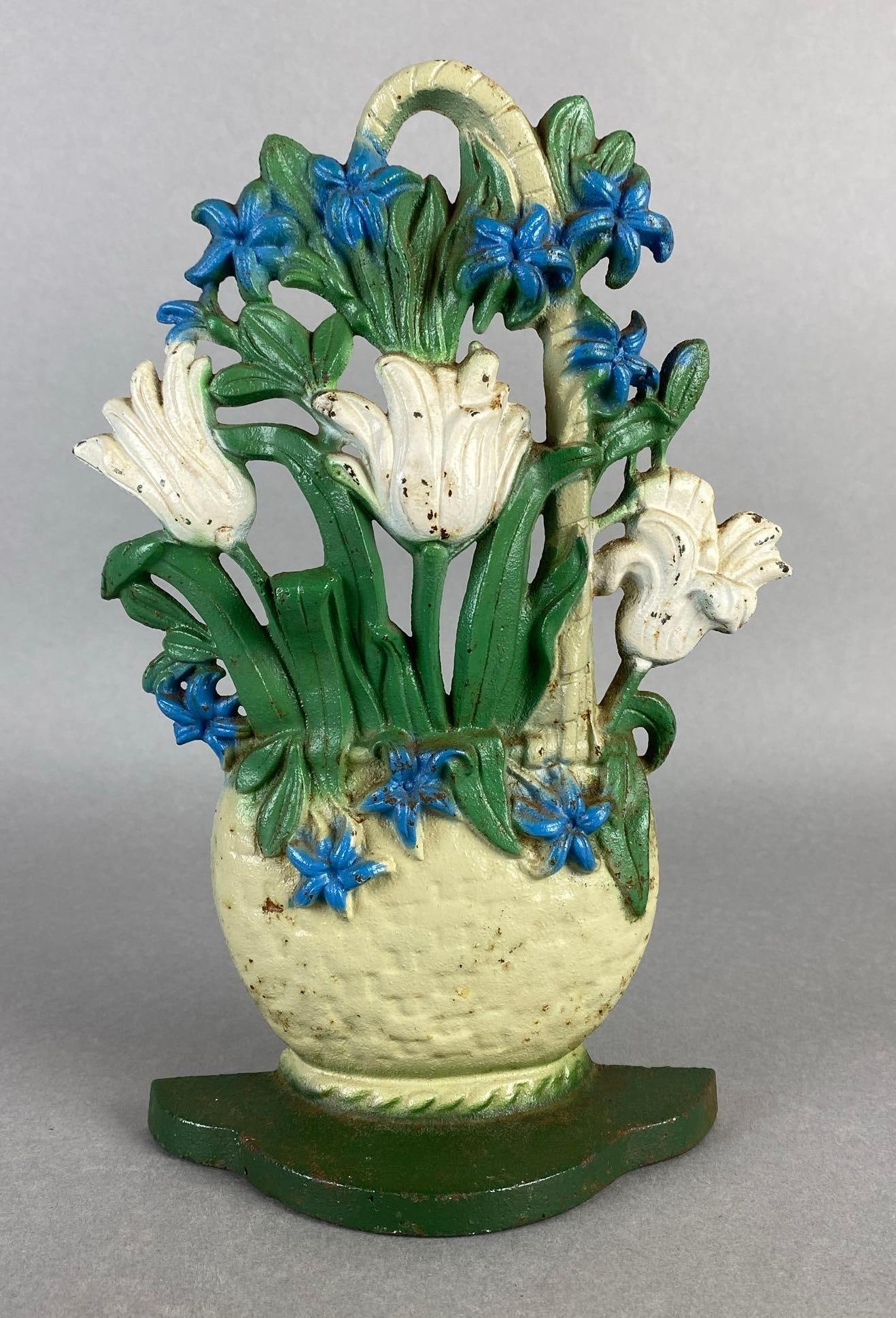 John Wright Cast Iron Flower Basket Doorstop: Marked 471 on back, Measures 9 3/4 x 5 1/2 x 2 inches.